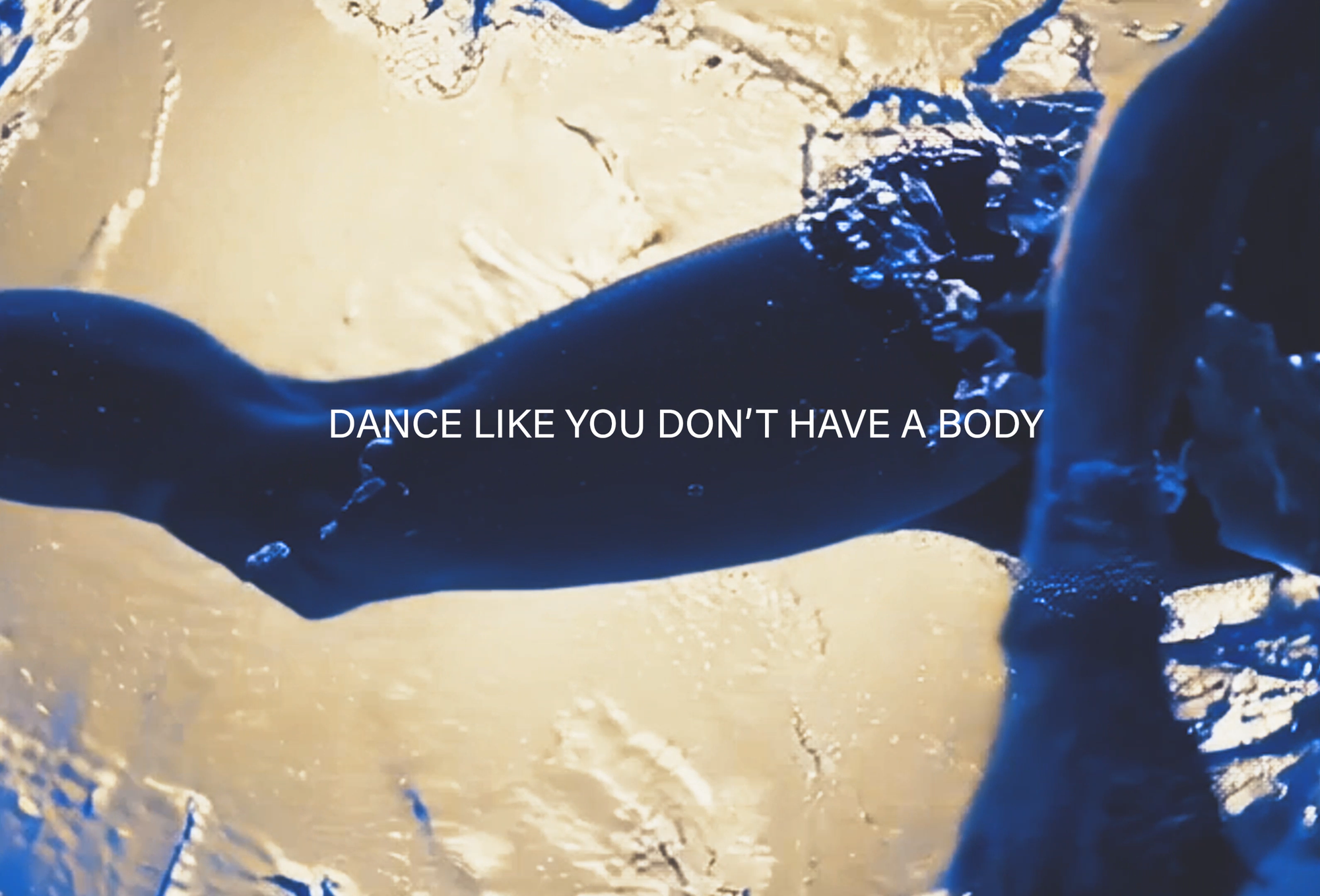 Rough shape of blue legs against a orange-tan backdrop with "Dance Like You Don't Have a Body" written on the screen in all caps.